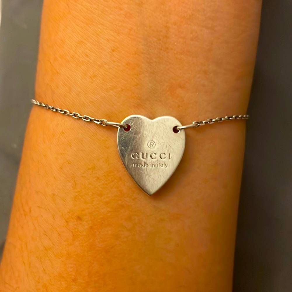 Authentic Gucci Sterling silver heart bracelet with trademark.